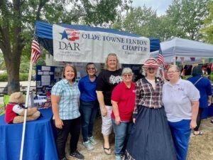 women in fron tof DAR booth at Greentree Festival